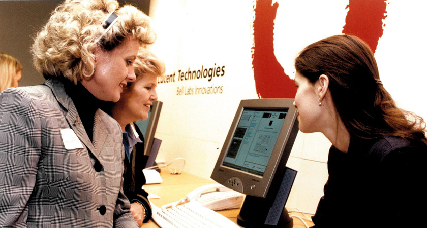 picture of Ann Buller visiting a Lucent Technologies display